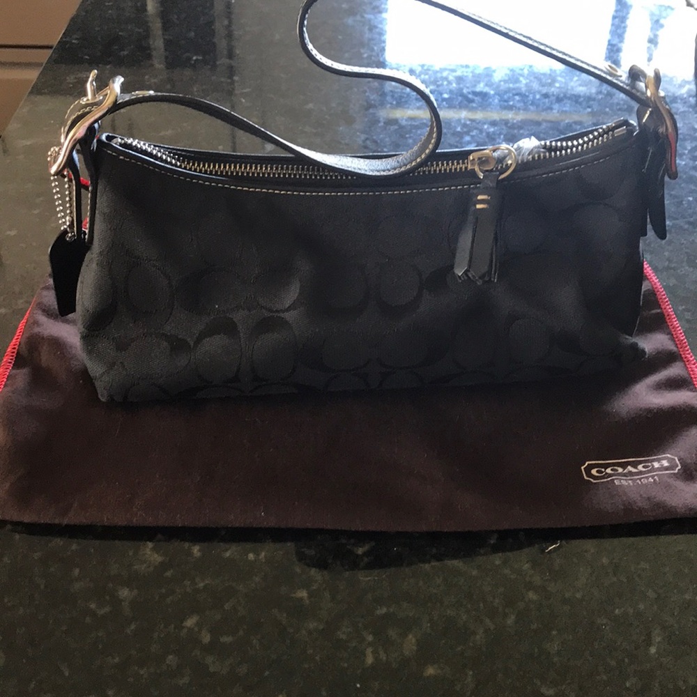 Very pretty coach pocket book